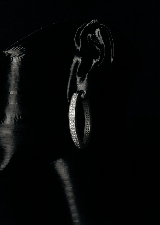 Close-up of a diamond ring on a dark background