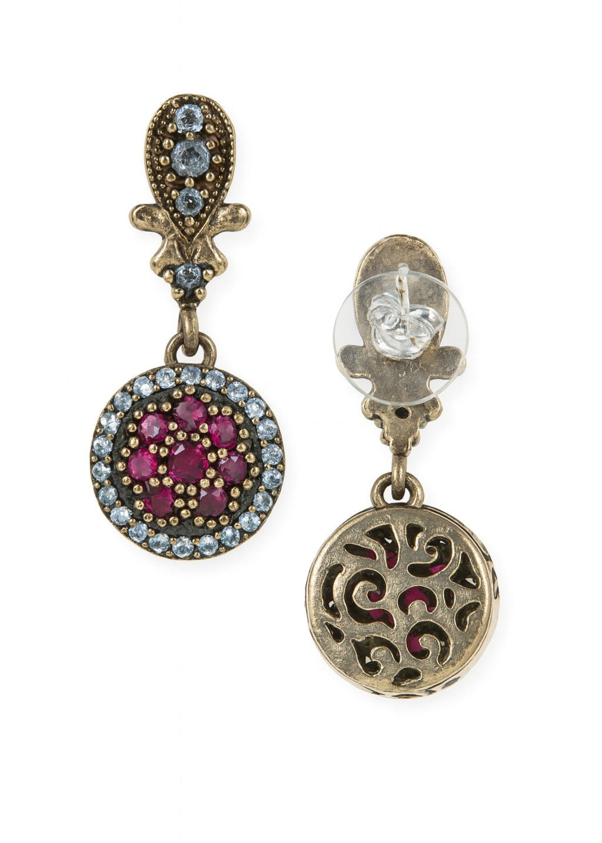Pair of ornate earrings with gemstones on a white background