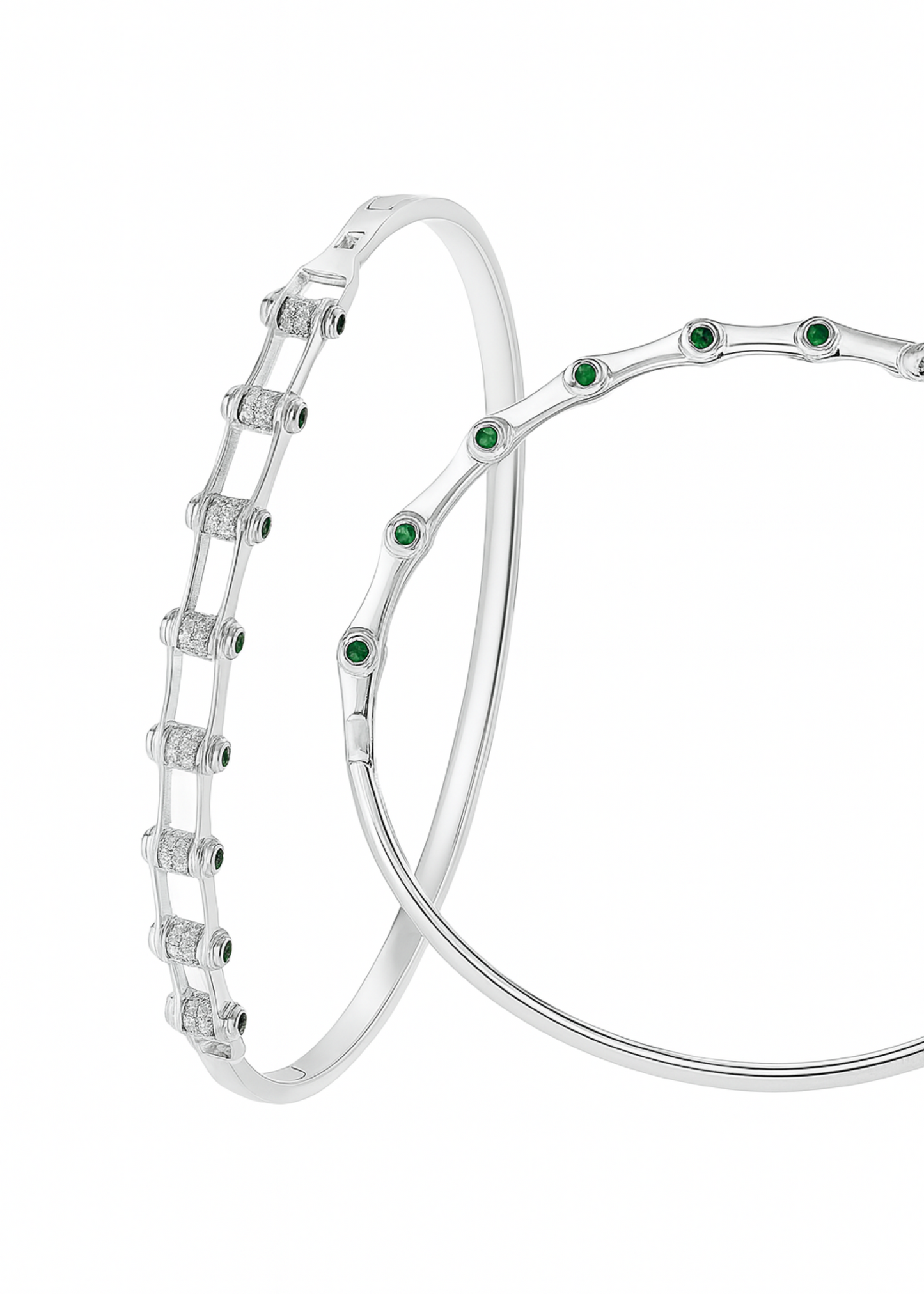 Silver bracelet with green gemstones on a white background