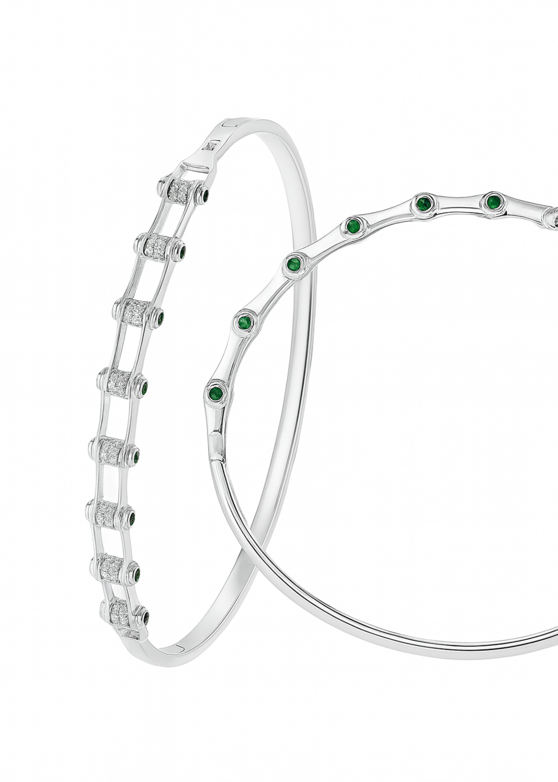 Silver bracelet with green gemstones on a white background