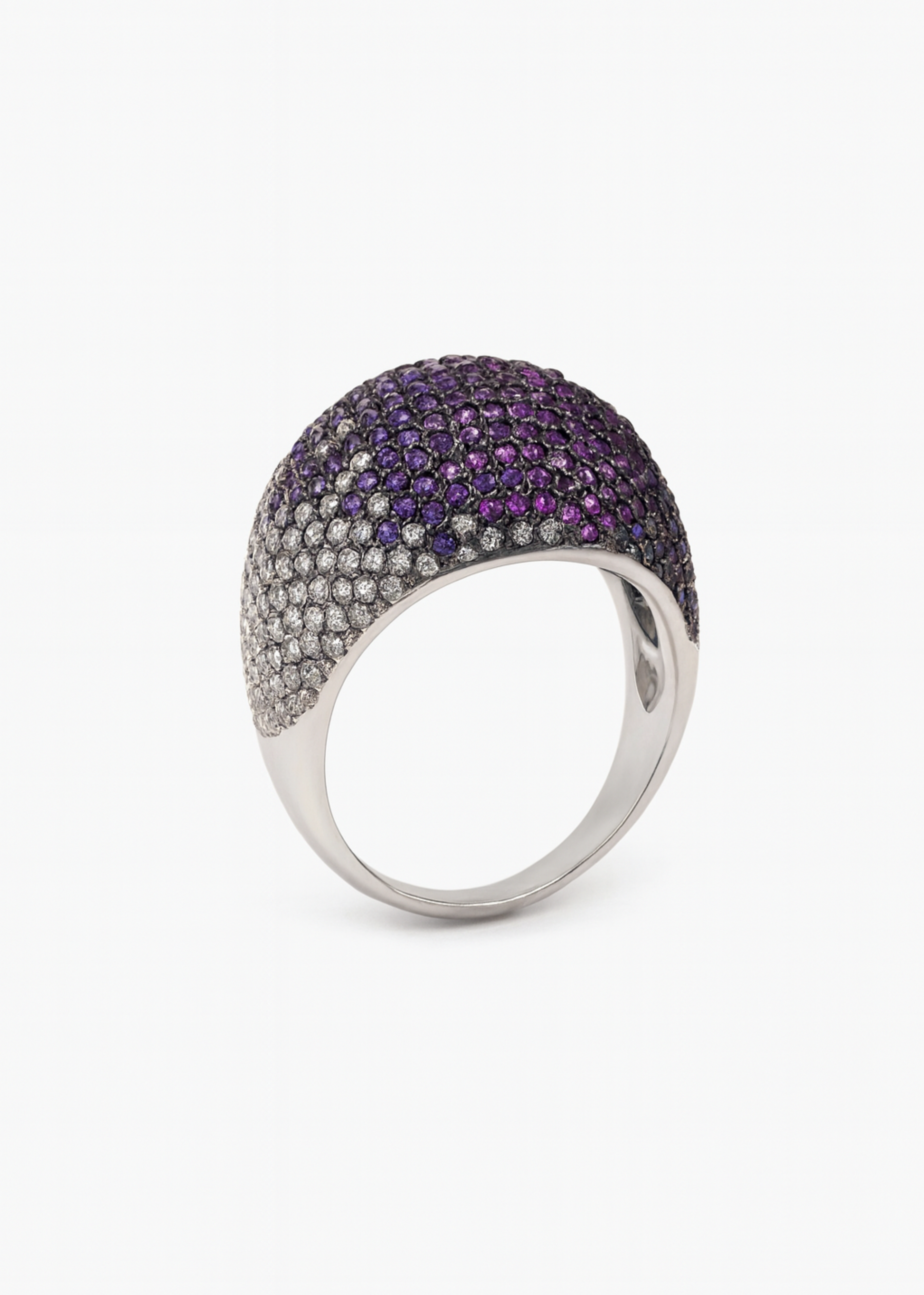Ring with purple and silver stones on a white background