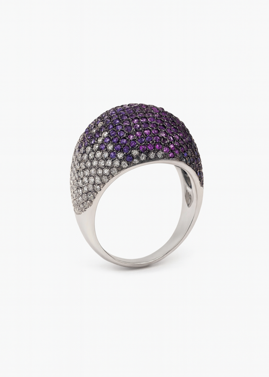 Ring with purple and silver stones on a white background