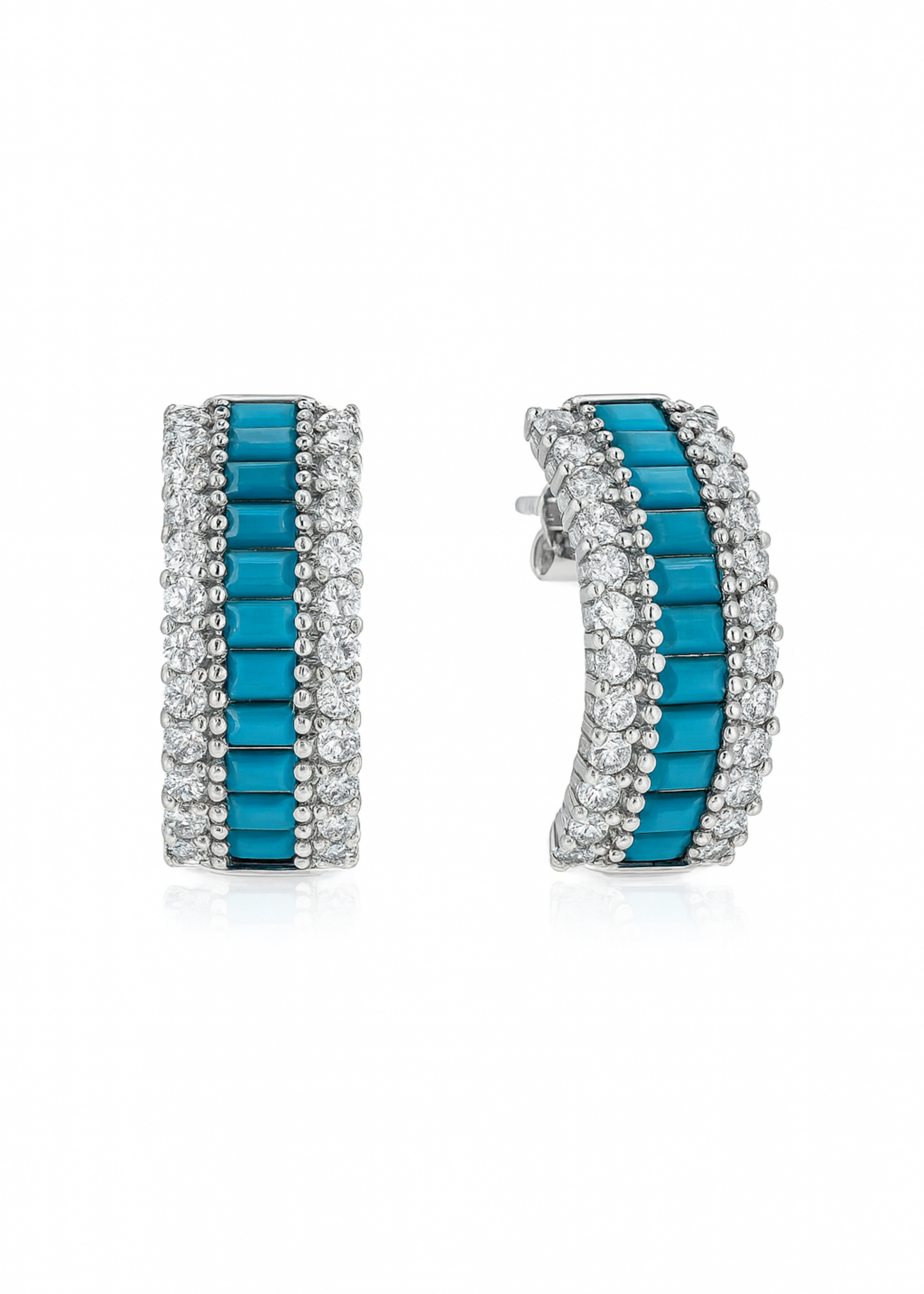 Pair of earrings with turquoise stones and silver accents on a white background