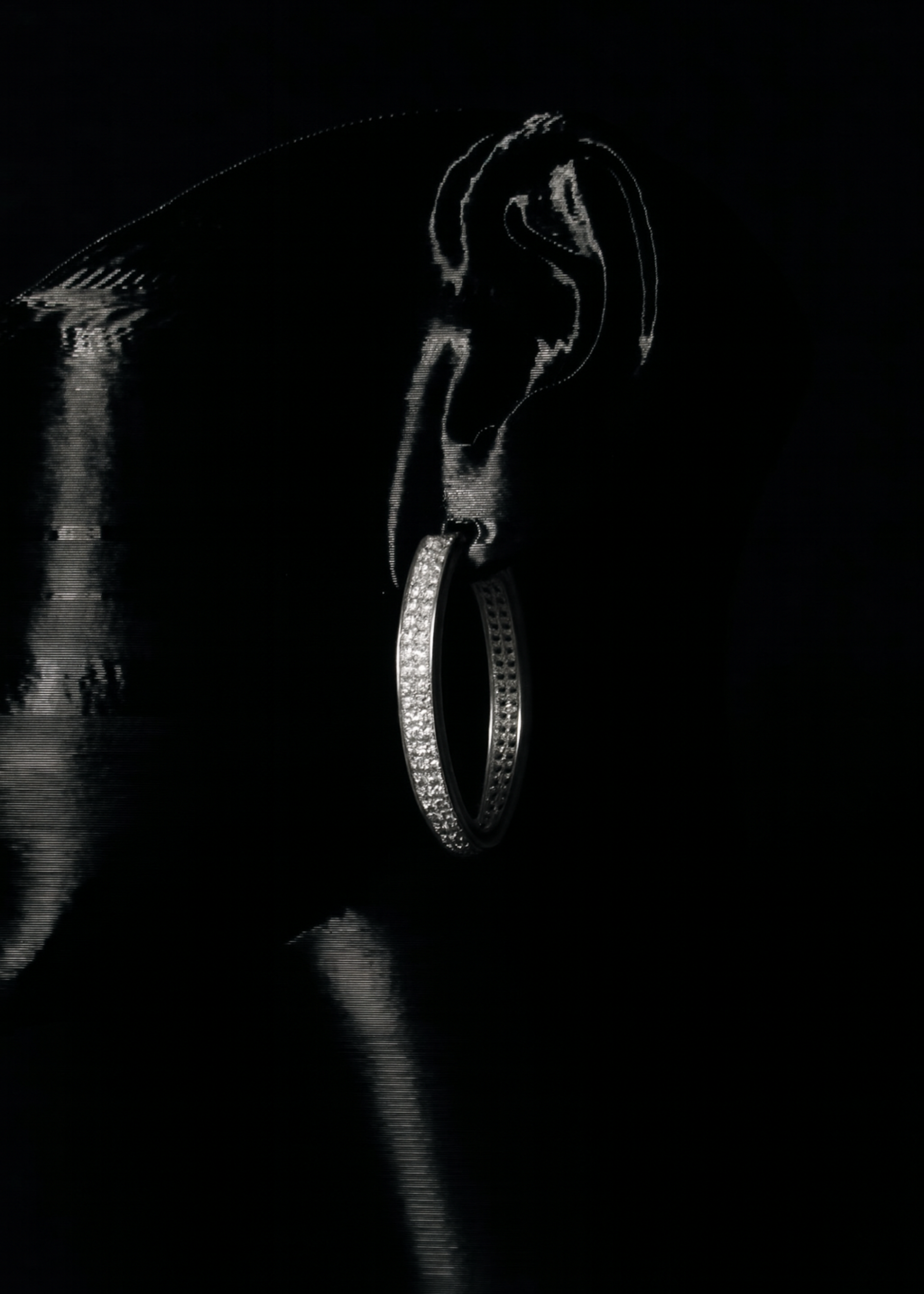 Close-up of a diamond ring on a dark background