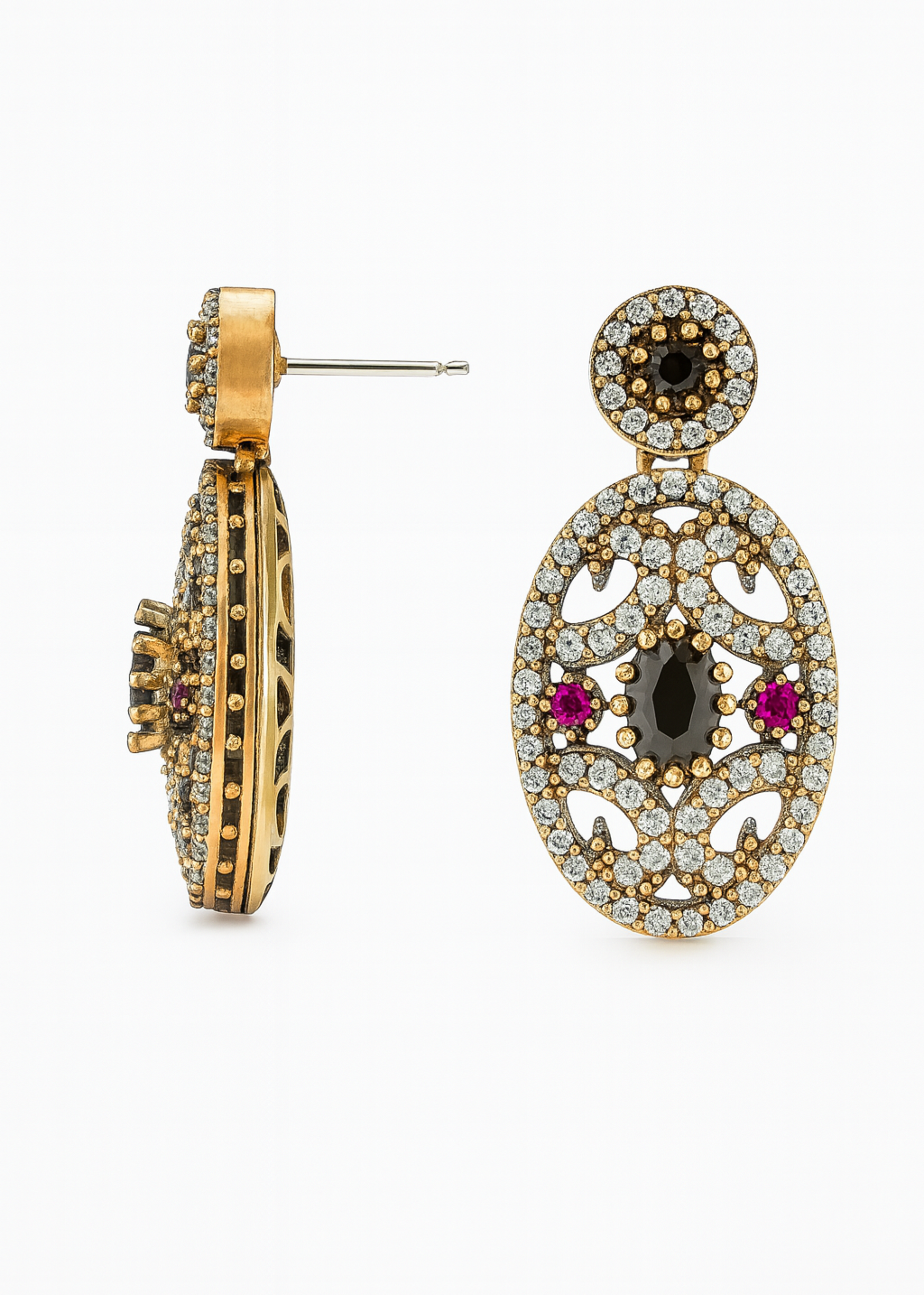 Pair of gold earrings with gemstones on a white background