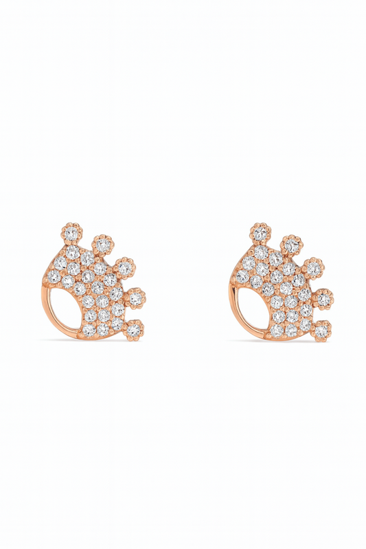 Rose gold crown-shaped earrings with clear gemstones on a white background