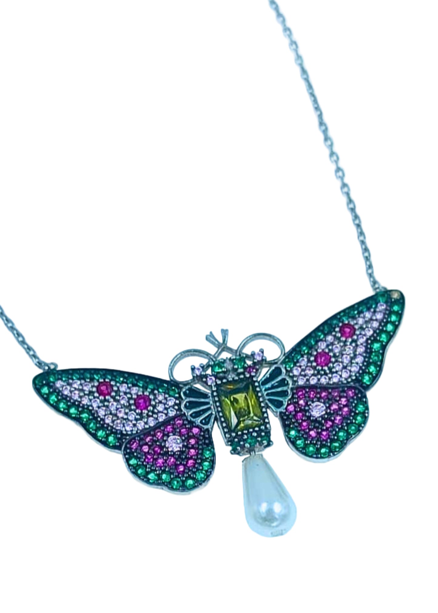Butterfly-shaped necklace with gemstones on a light blue background