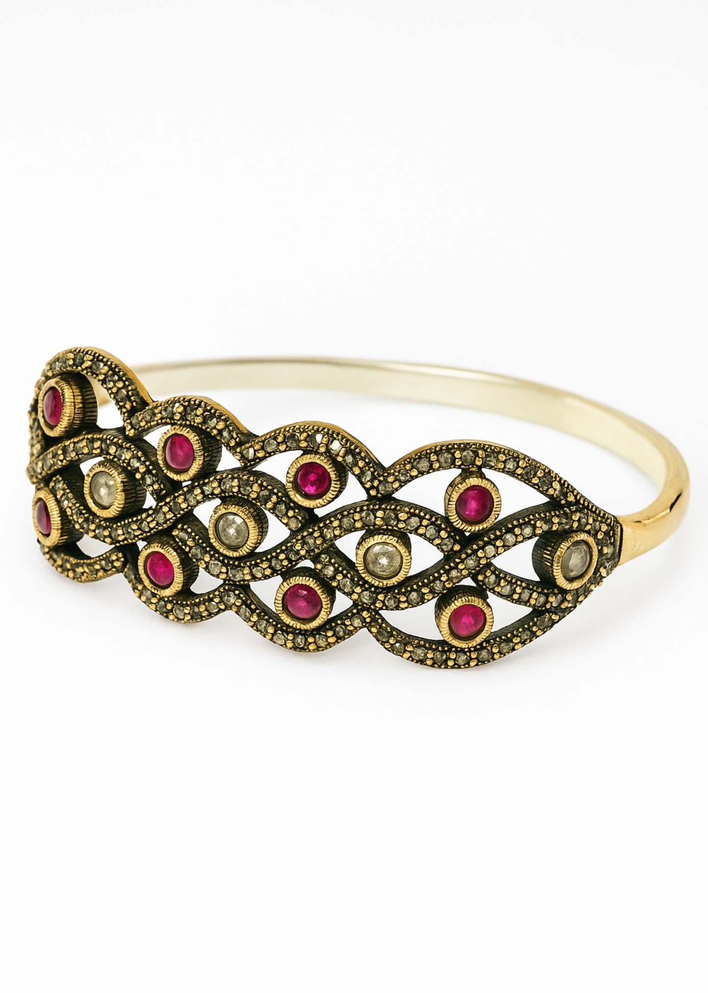 Gold bracelet with red gemstones on a white background