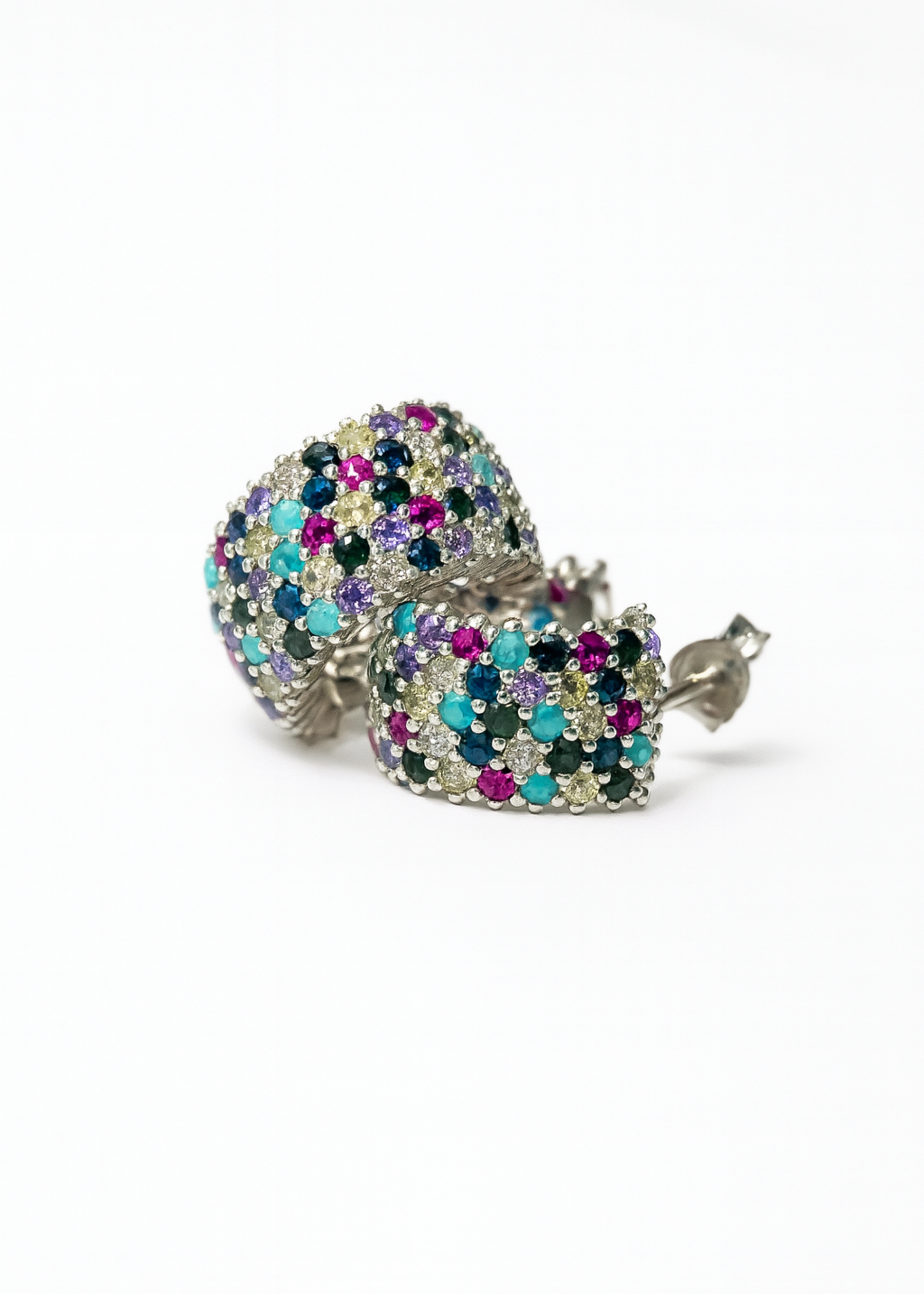 Multicolored gemstone earrings on a white background