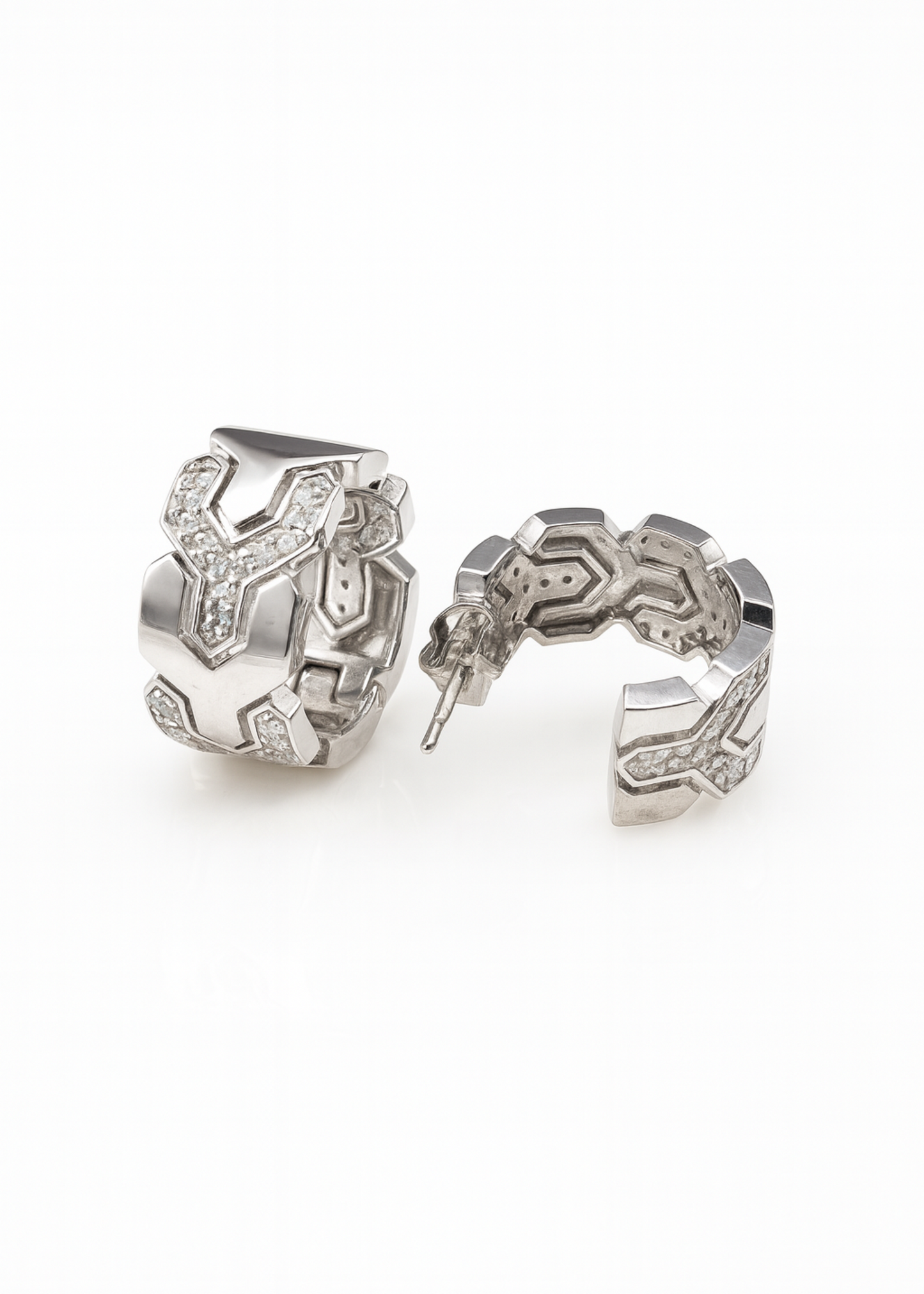 Pair of silver hoop earrings on a white background