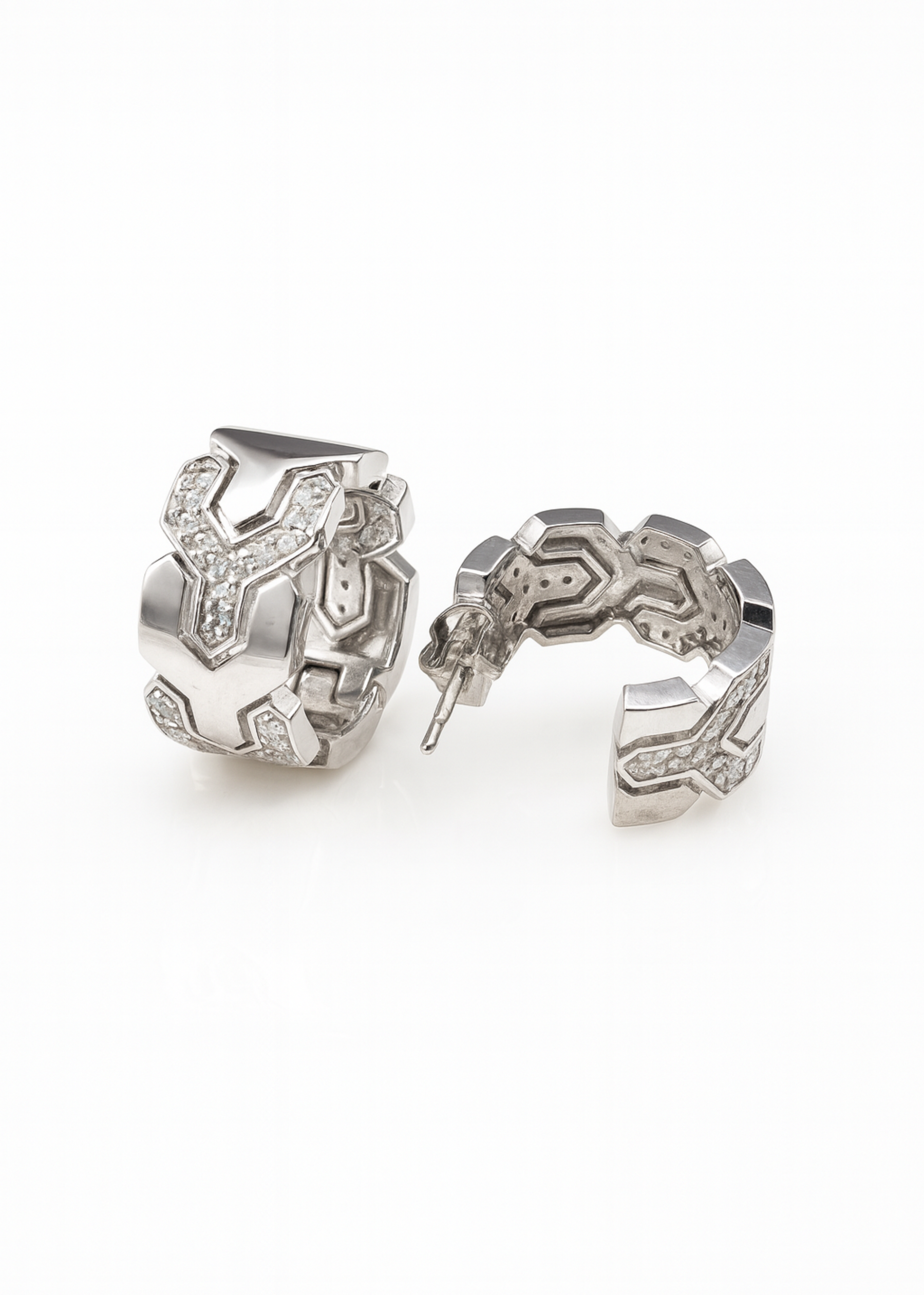 Pair of silver hoop earrings on a white background