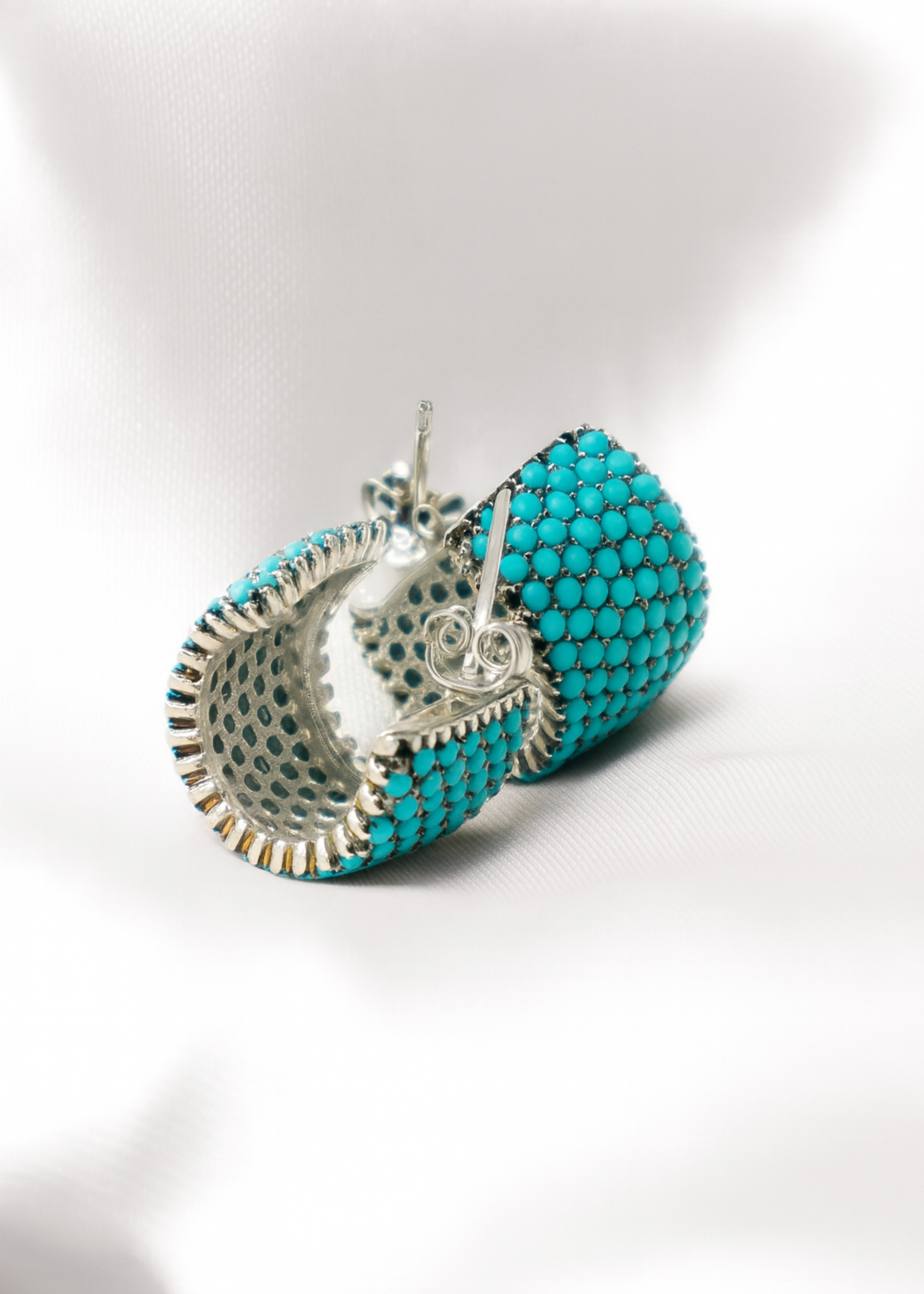 Turquoise beaded earrings on a white background