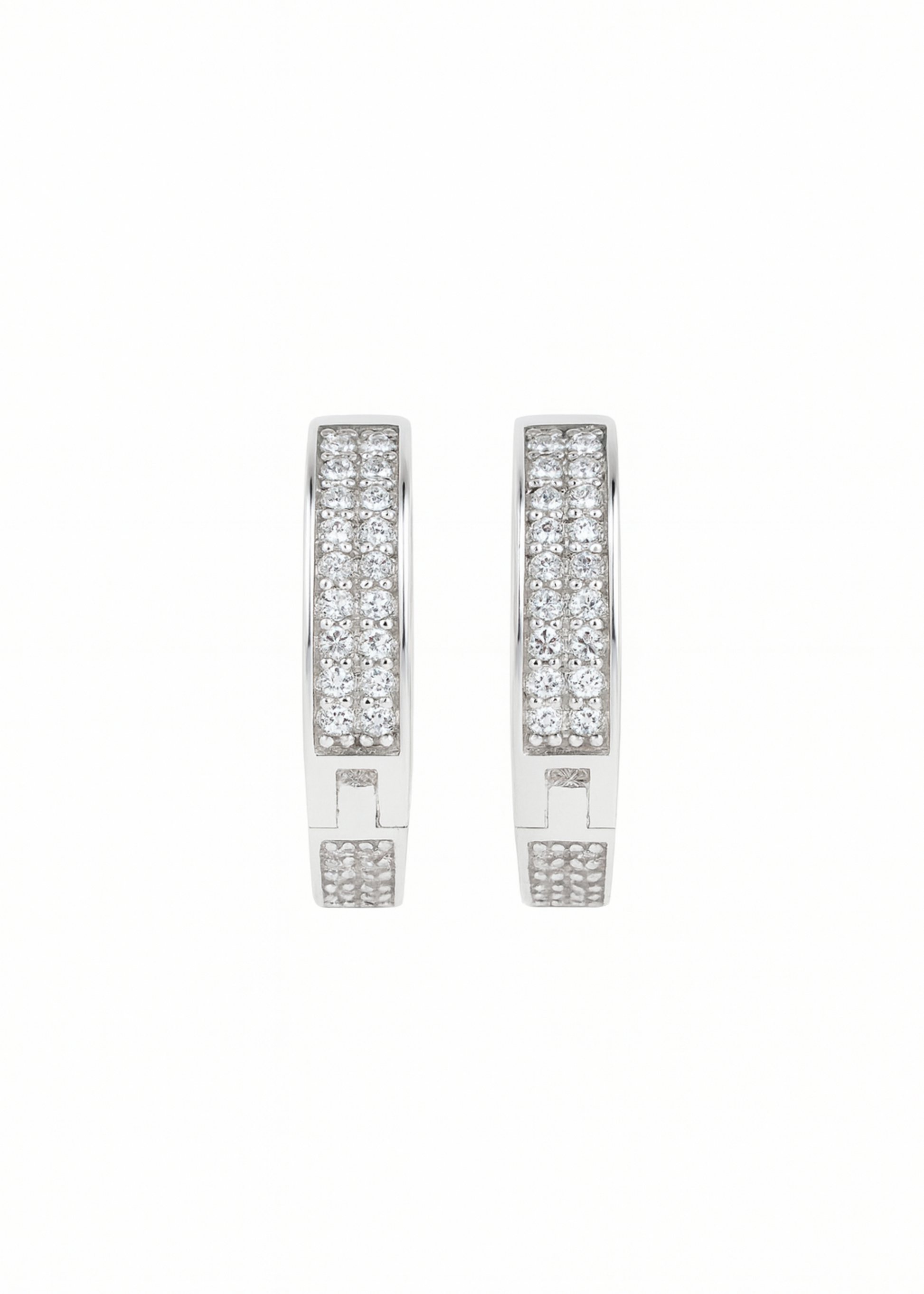 Pair of silver earrings with clear gemstones on a white background