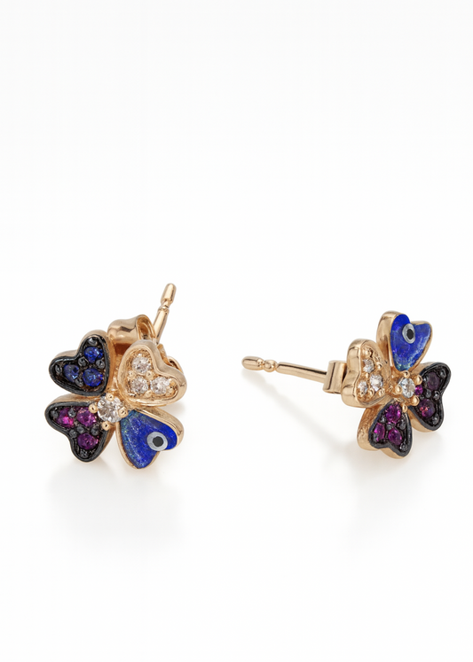 Butterfly-shaped earrings with colorful gemstones on a white background