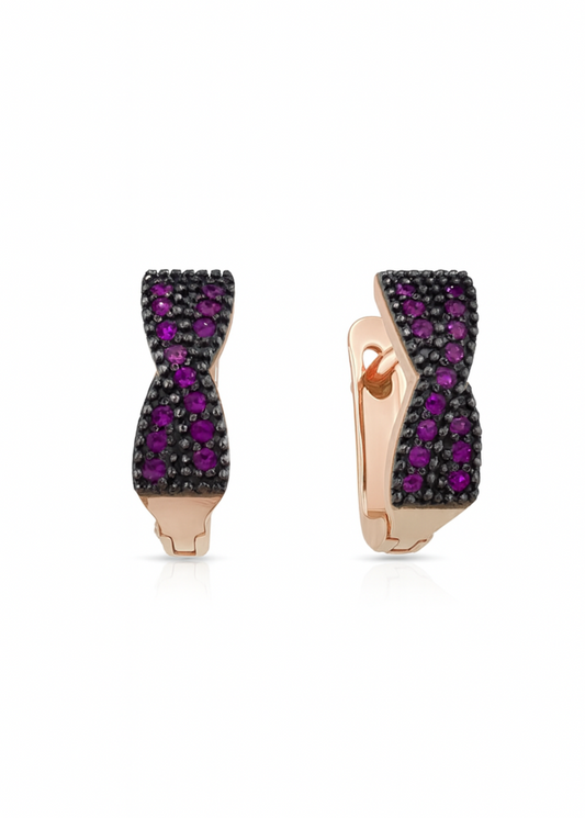 Pair of earrings with rose gold setting and purple gemstones on a white background