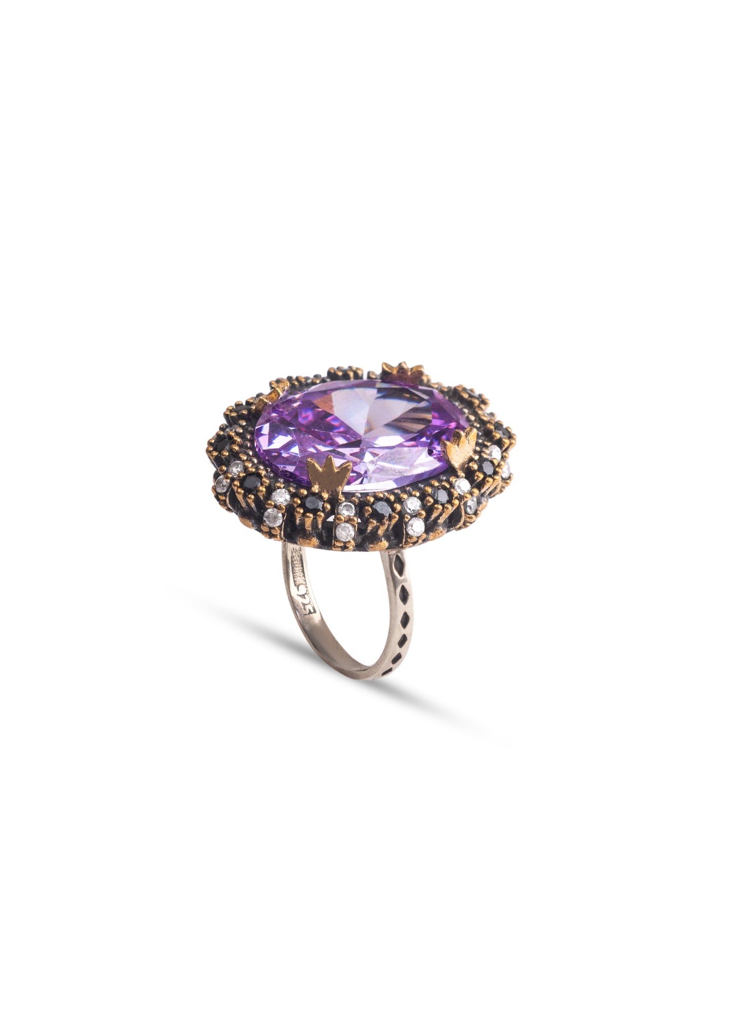 Ring with a purple gemstone and gold accents on a white background