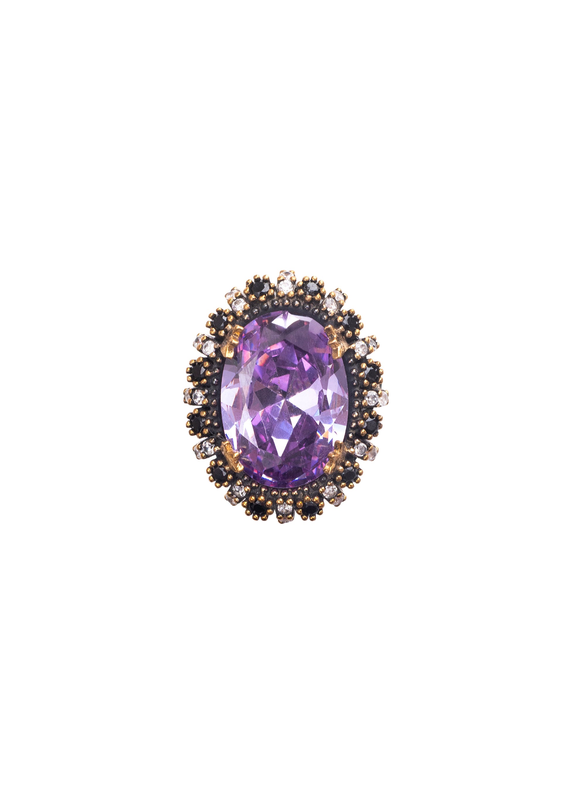 Purple gemstone in a decorative metal setting on a white background