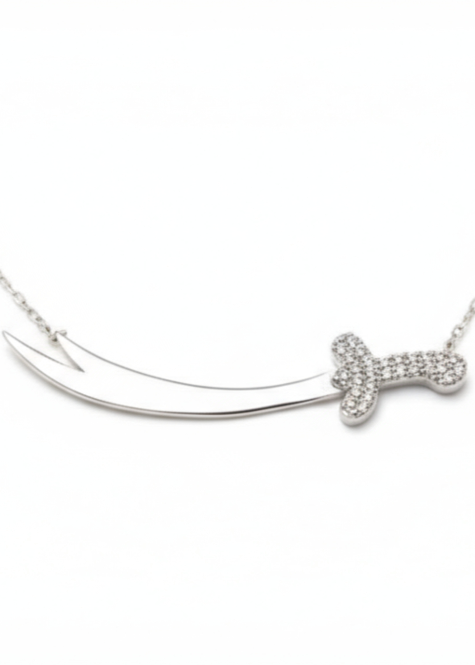 Silver necklace with a bow-shaped pendant on a white background
