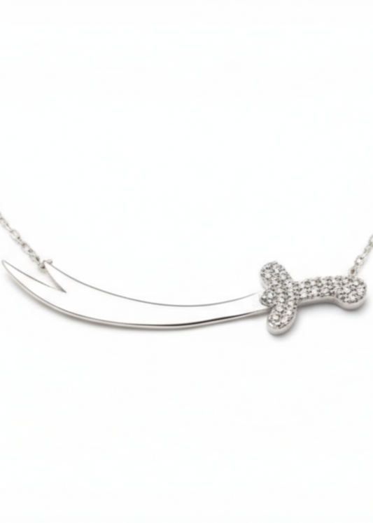 Silver necklace with a bow-shaped pendant on a white background